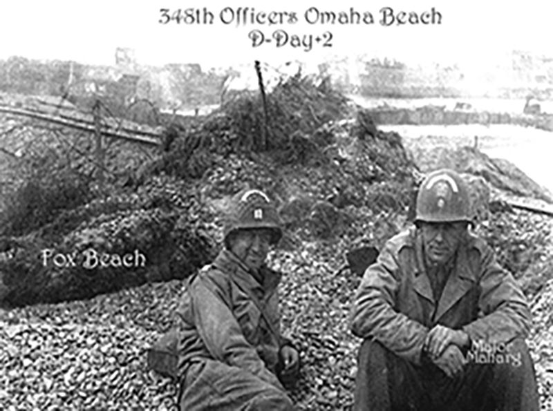 D-Day +2 Combat Engineering Company A Officers catching a moments rest on Omaha Beach.